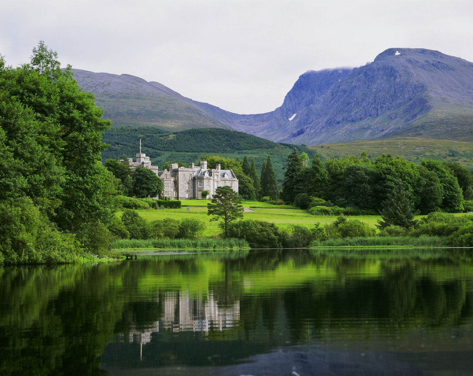 The Inverlochy Castle Hotel in Scotland with views of the loch and Ben Nevis
