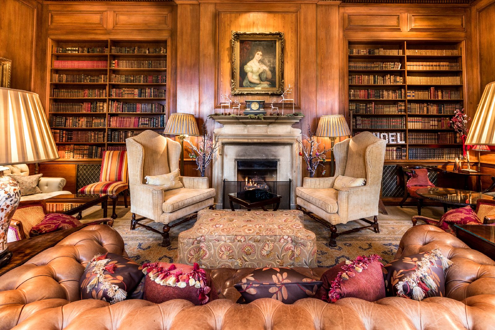 The library and fireplace at Lucknam Park hotel in the Cotswolds England