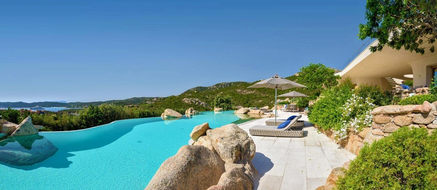 Large pool with loungers and sea views at The Rock, luxury villa in Sardinia