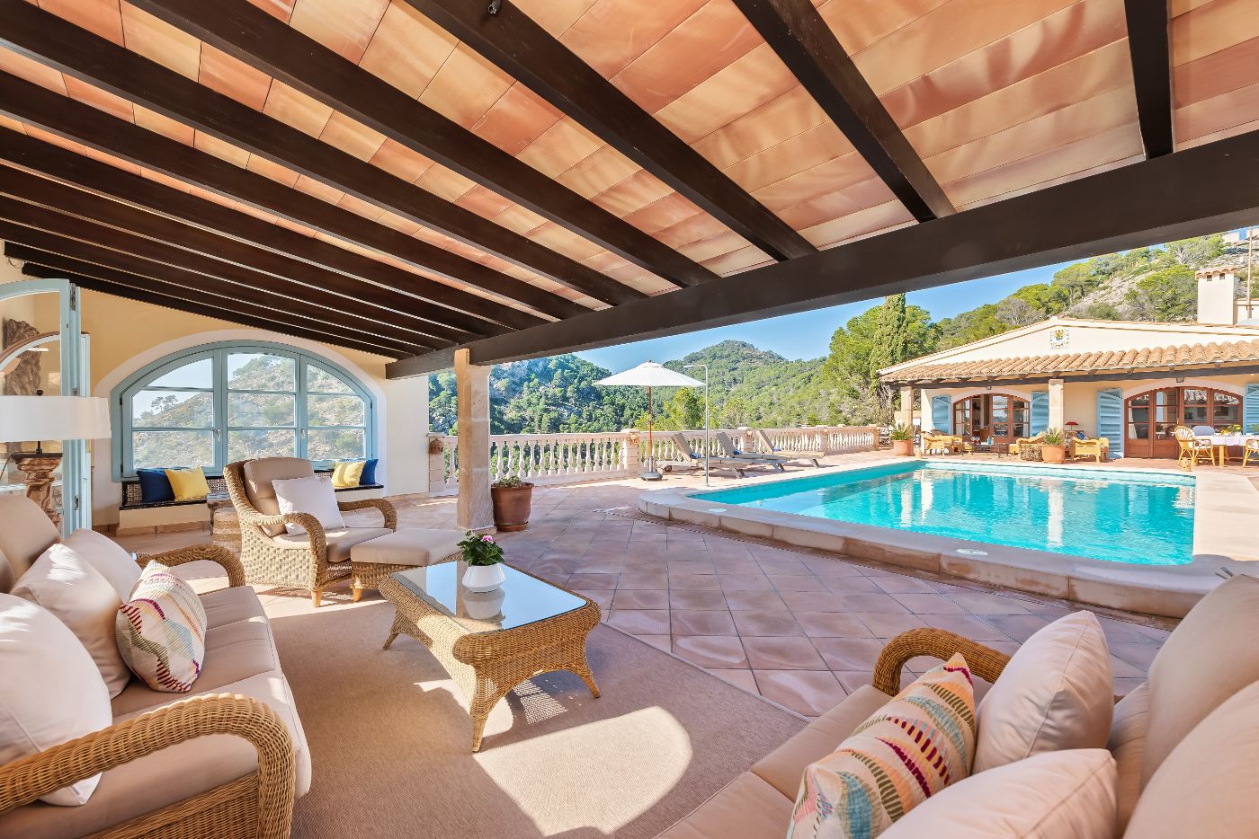 Pool and terrace with seating at Villa Canyamel