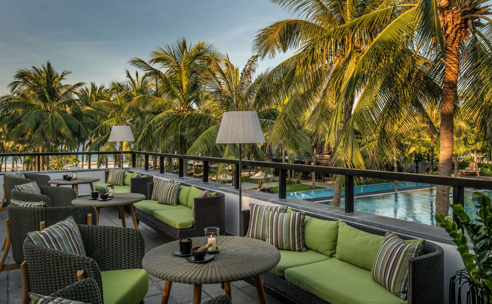 Rooftop seating area overlooking the main pool at luxury resort Four Seasons Nam Hai 