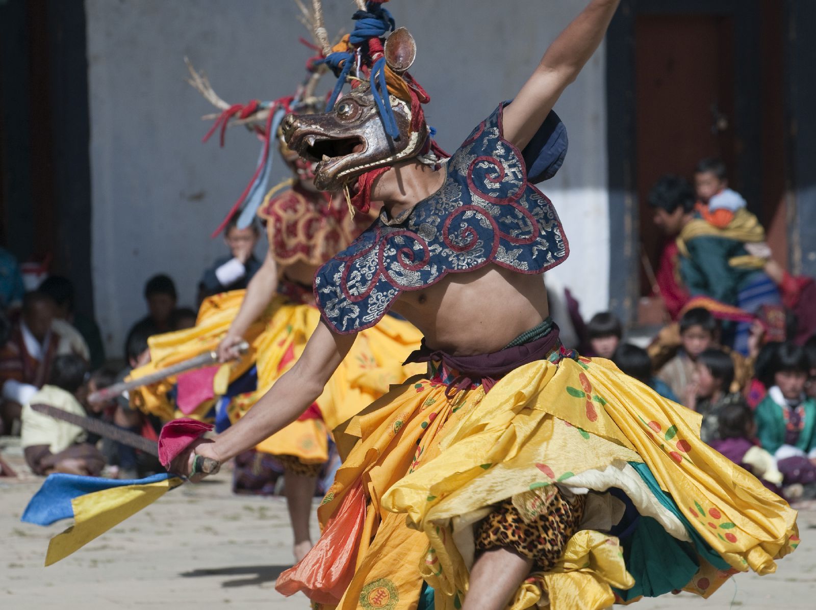 Dancers in traditional costume at a festival in Bhutan