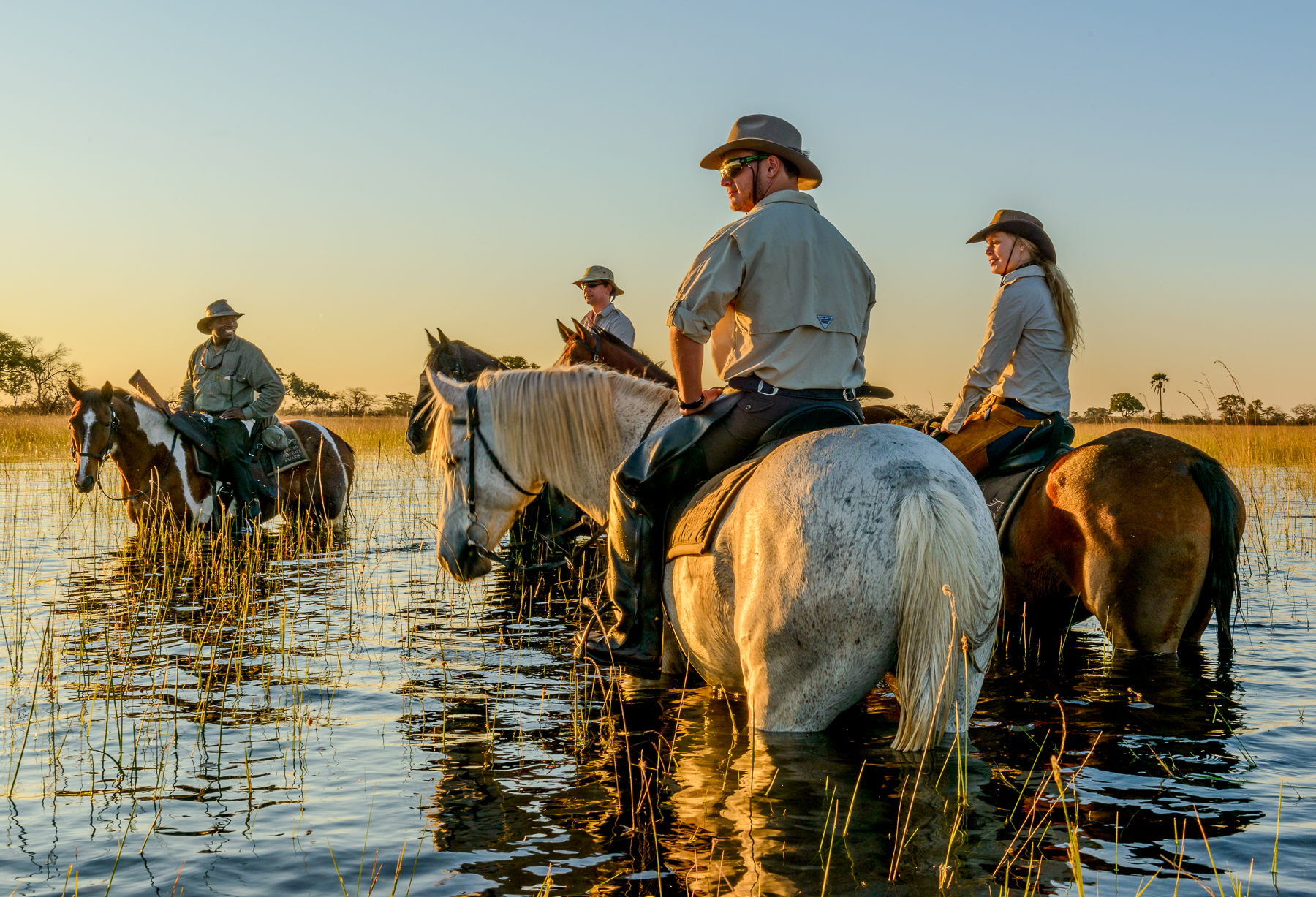 Riding through the floodplains at Macatoo Camp in the Okavango Delta