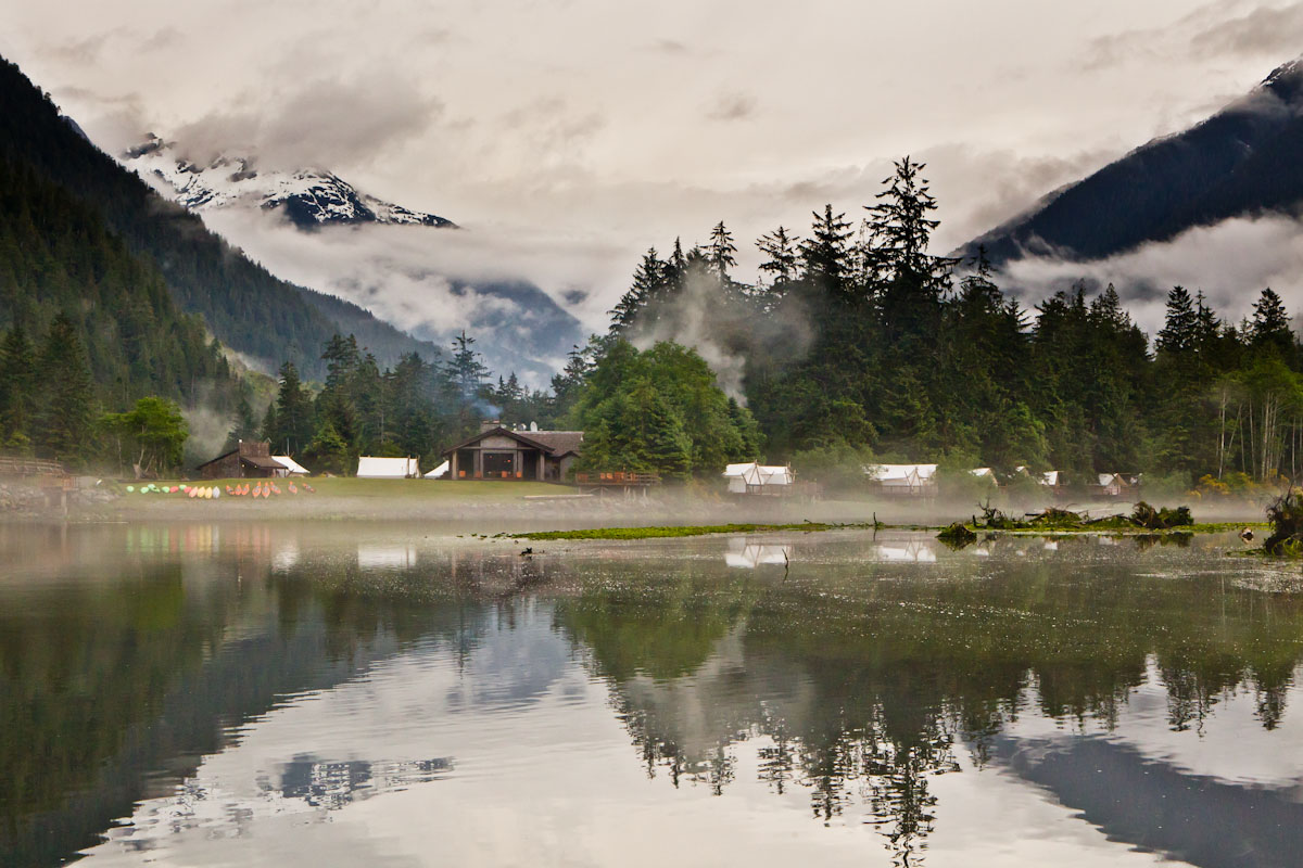 mountains reflecting in lake near Clayoquot Wilderness Resort, canada