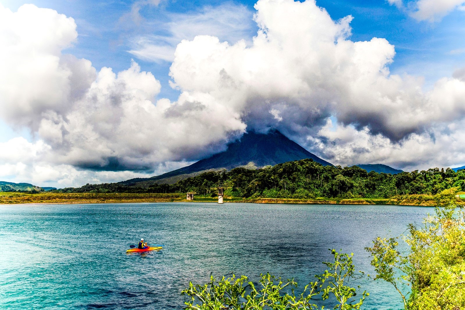 A man kayaking on Arenal Lake in Arenal Volcano National Park
