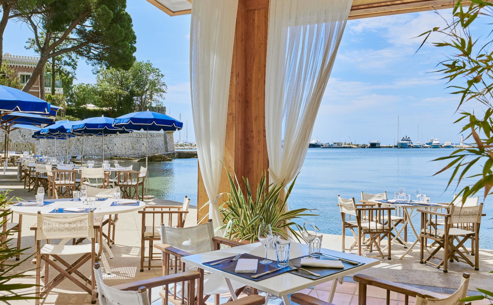 Waterside dining at Hotel Belles RIves on the Cote d'Azur in France