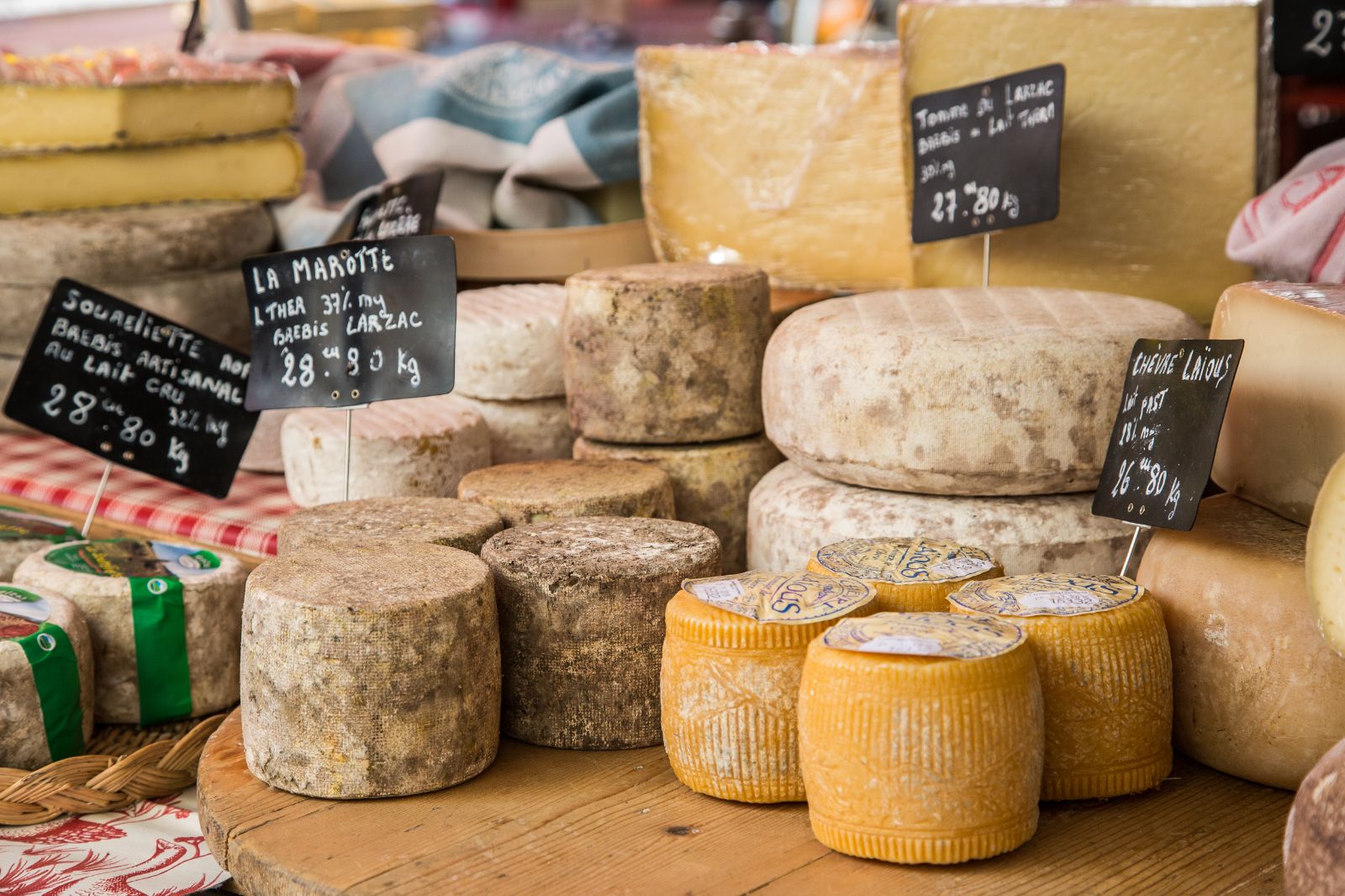 French cheeses displayed in a cheese store