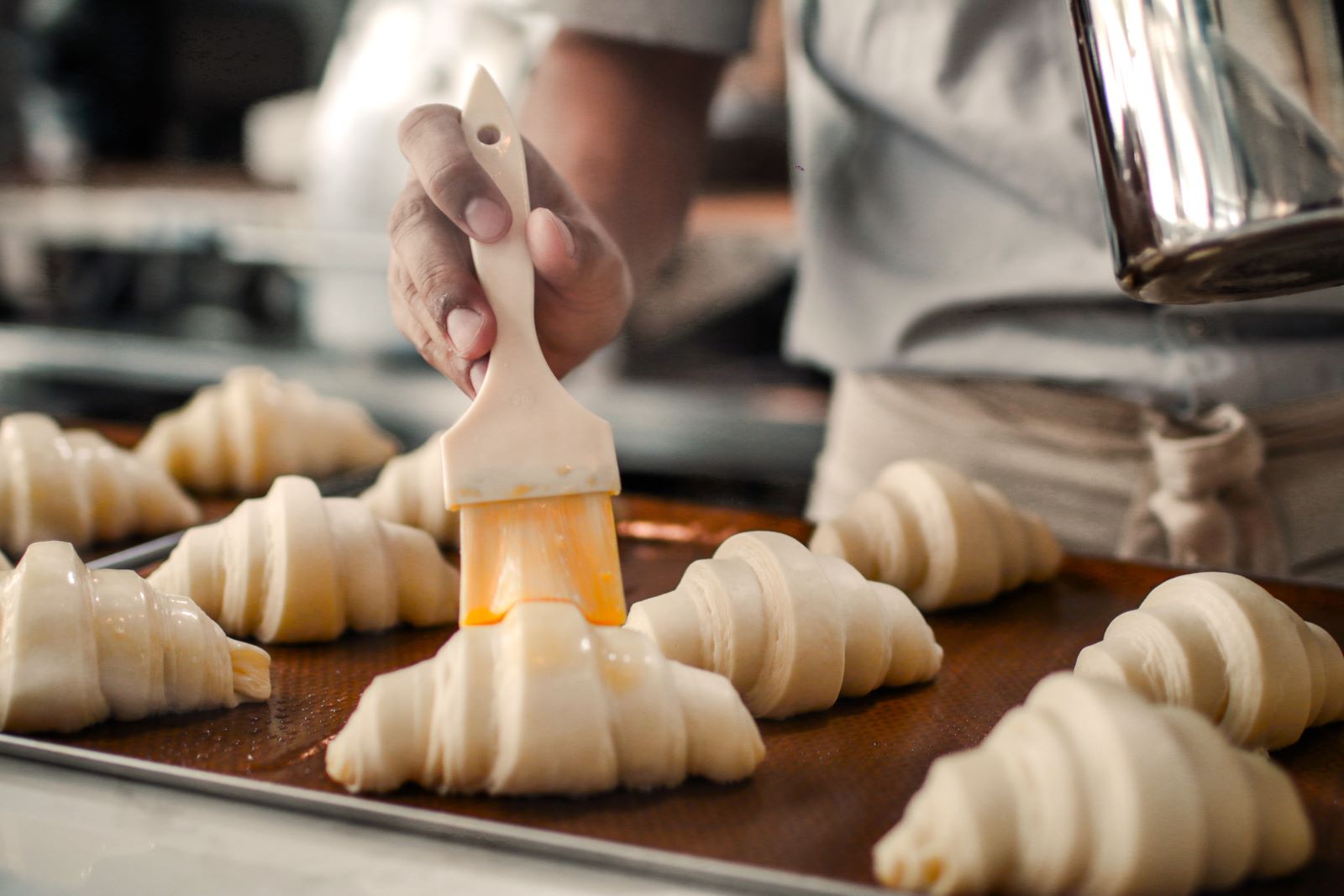 A pastry chef making croissants in France