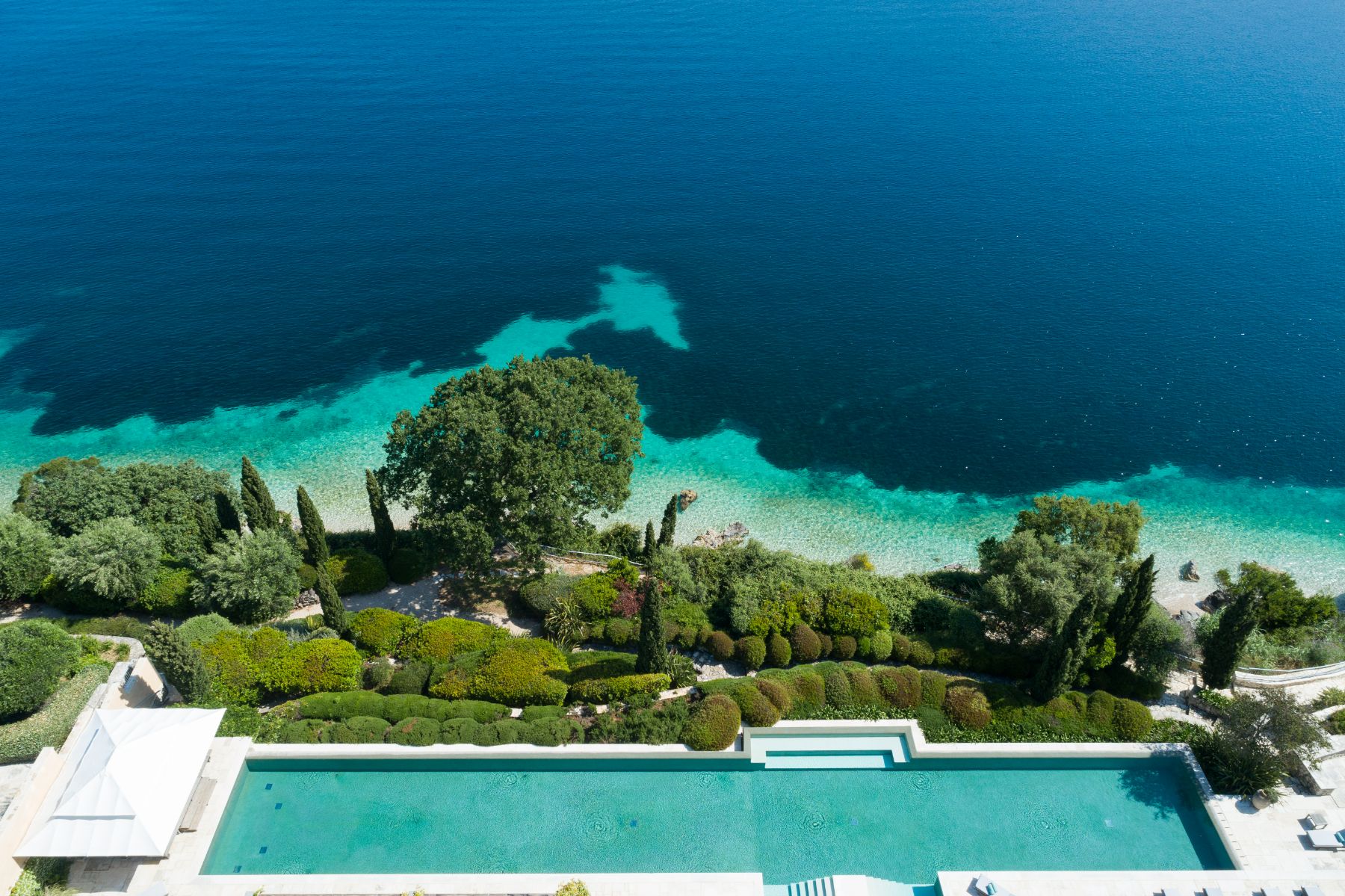 Aerial view of pool and coastline at Villa Penelope, Corfu