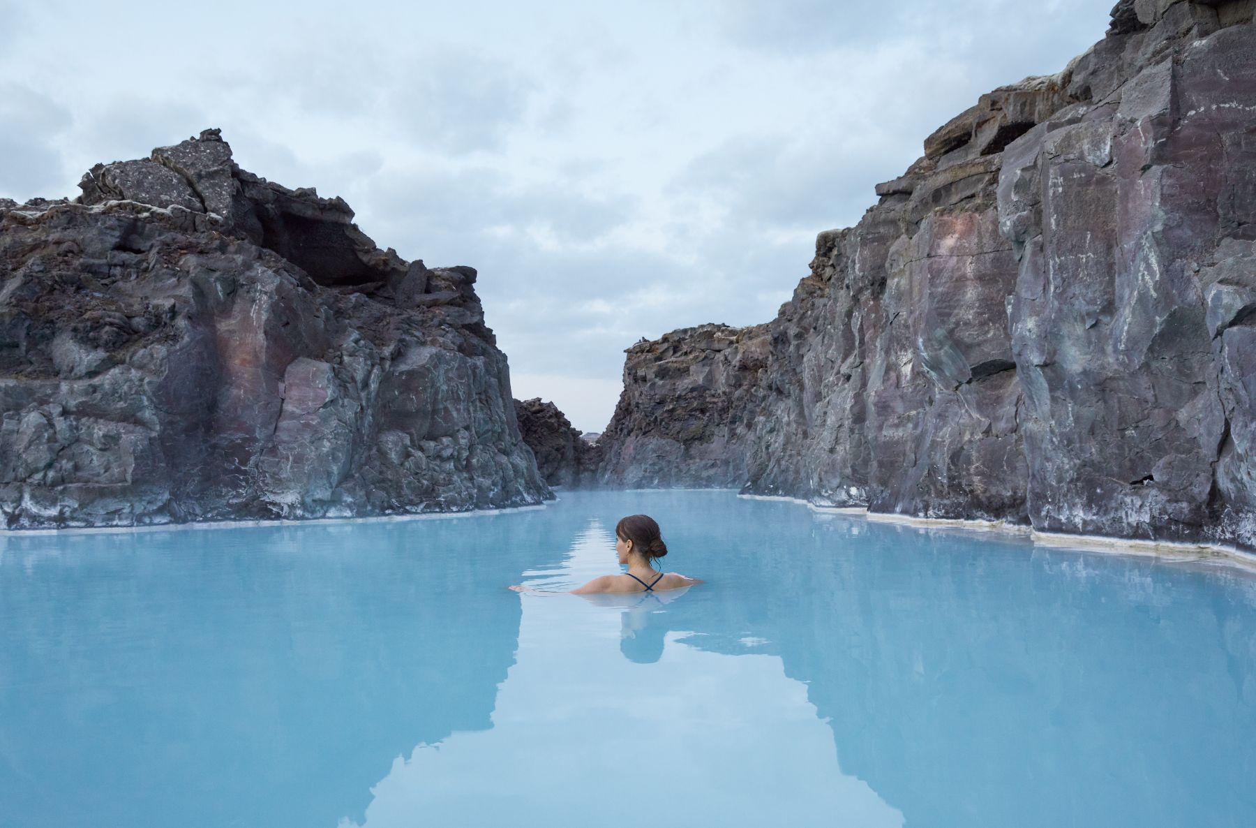 A lady soaking in the private thermal waters of The Retreat at the Blue Lagoon in Iceland