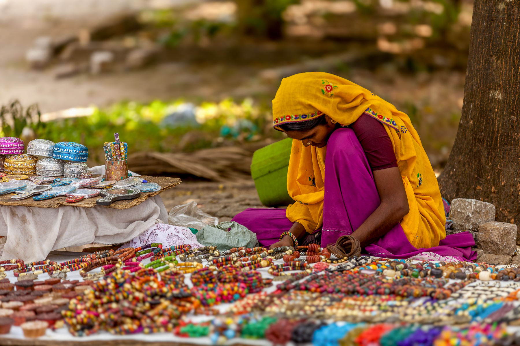 A woman selling her wares during a street market in Kerala