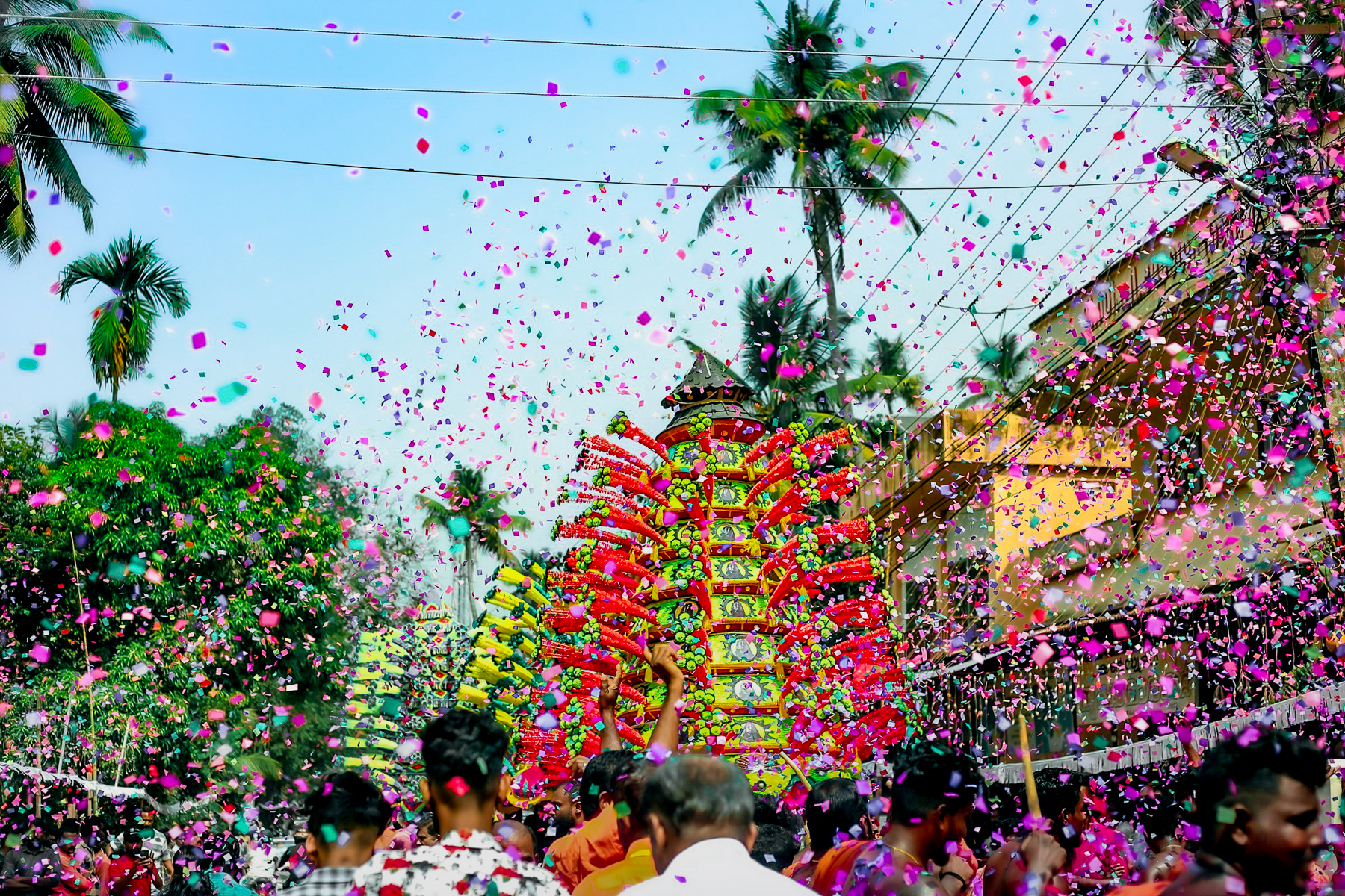 Confetti being thrown during a festival in Kerala