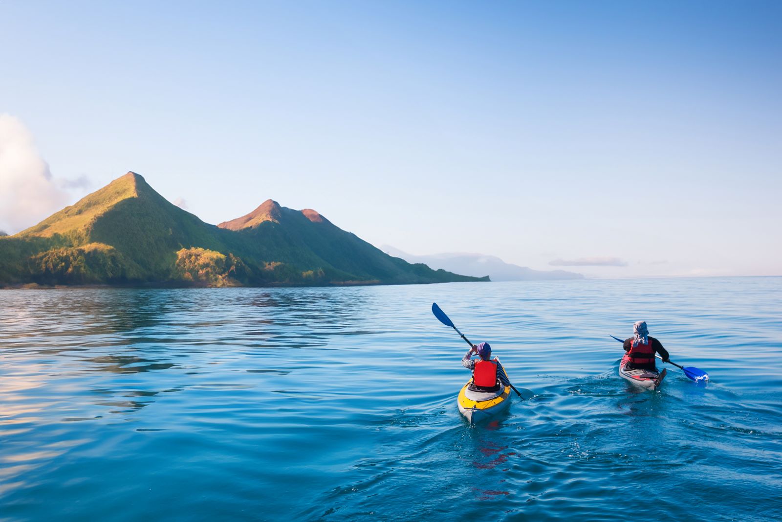 Two people kayaking in the ocean around the Komodo Islands