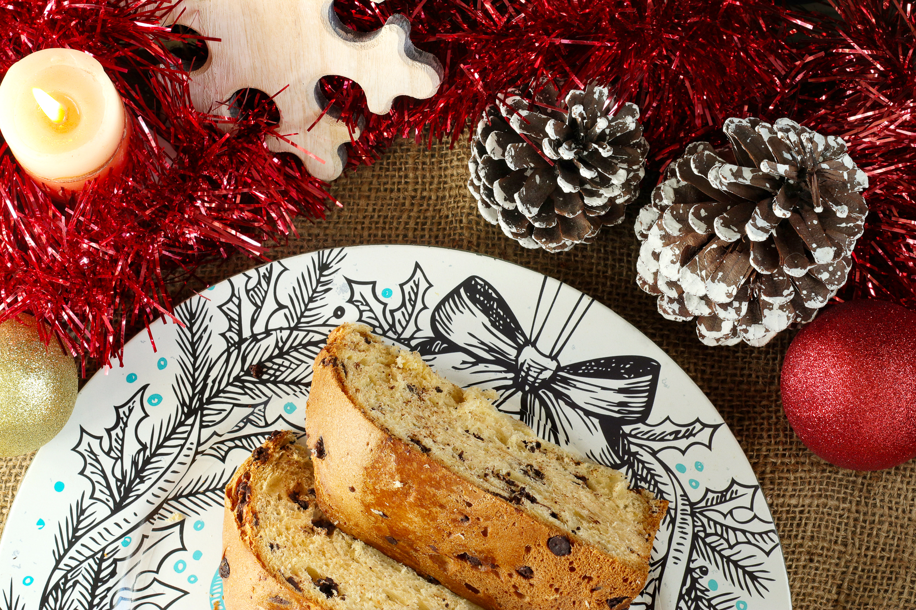 A panettone served on a Christmas dish