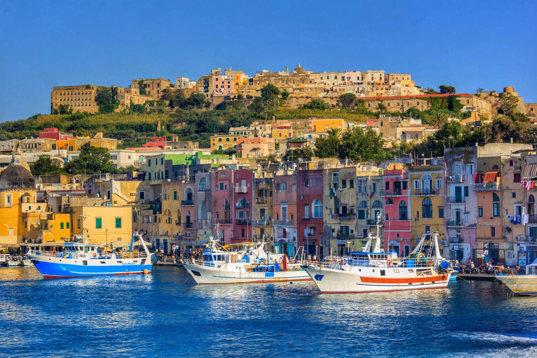 Harbour of Procida in front of colourful houses in the Bay of Naples