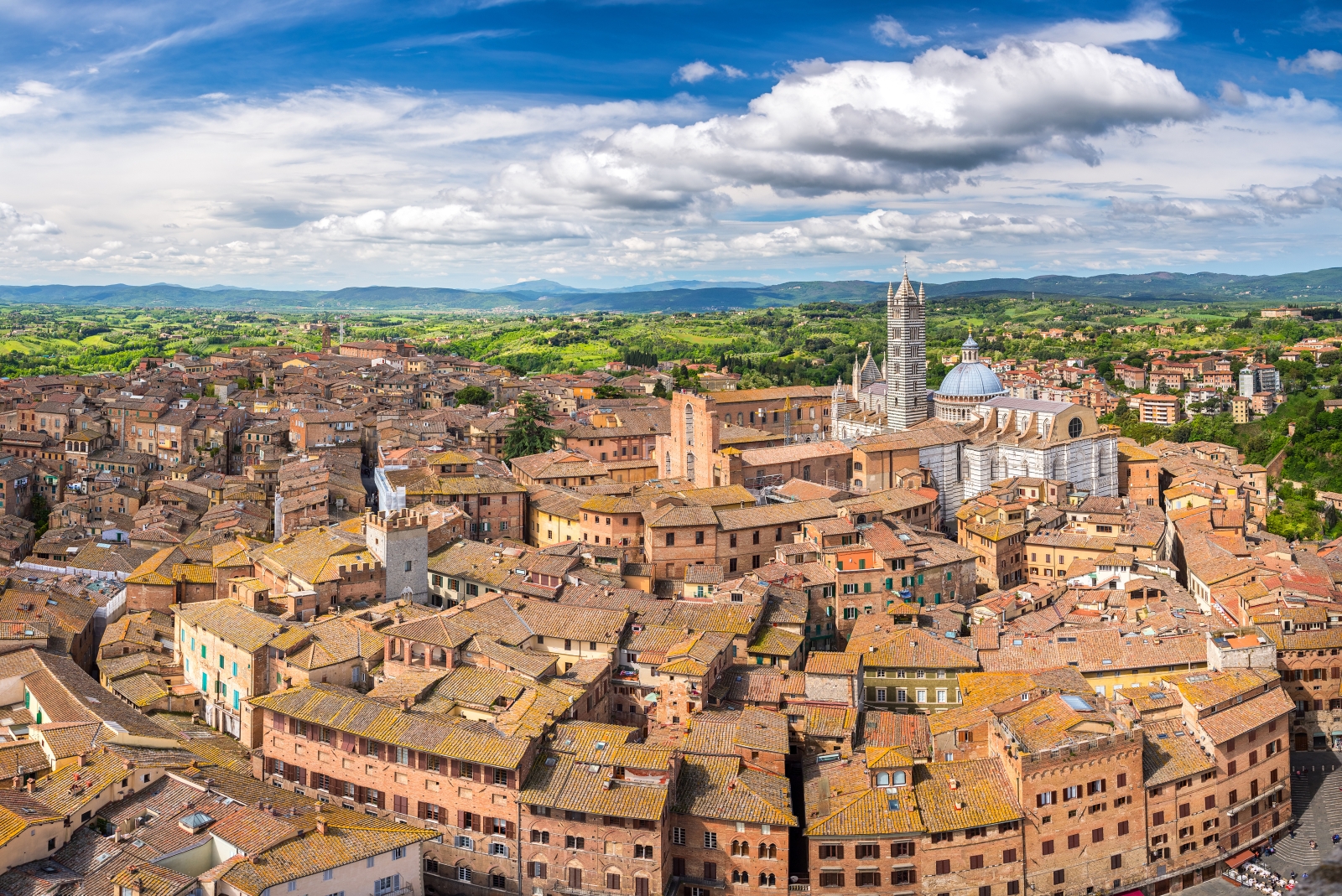 siena aerial shot with blue sky in italy