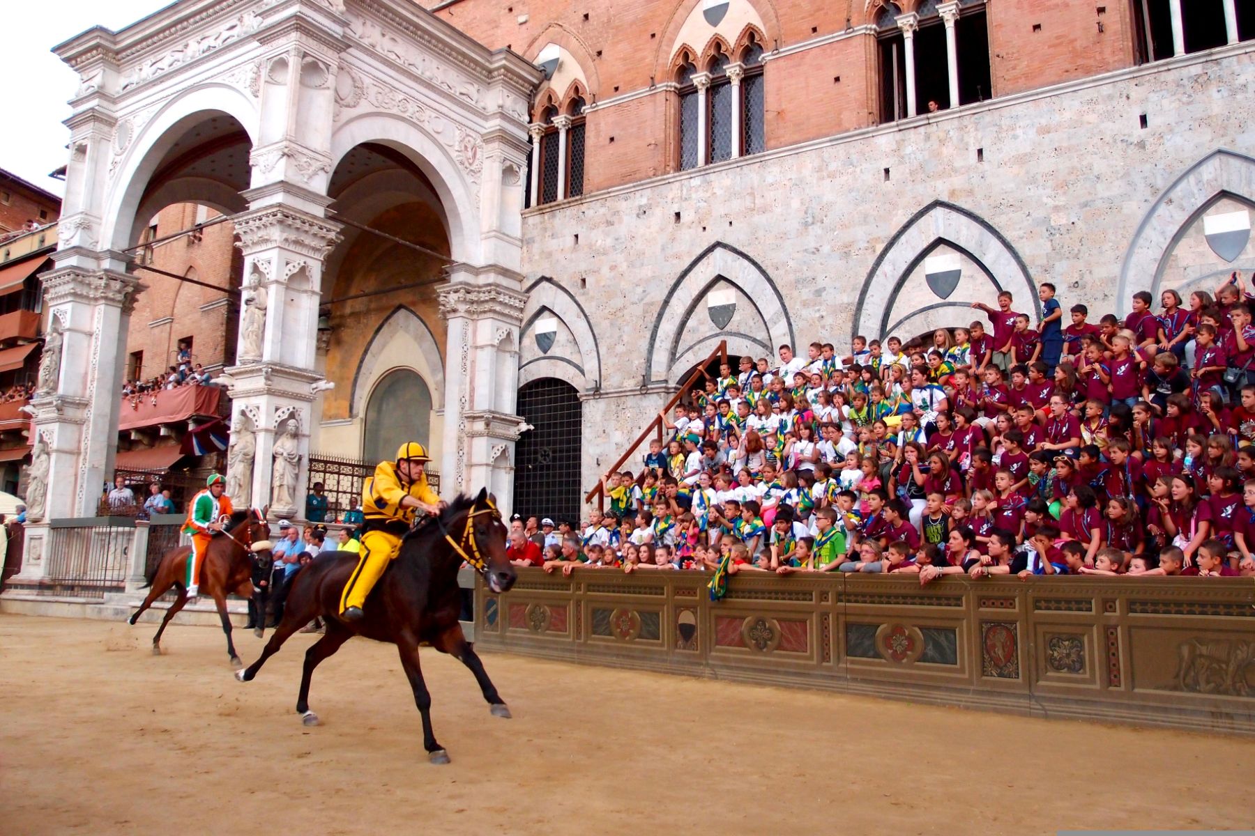 Riders and spectators during the Palio di Siena horse show