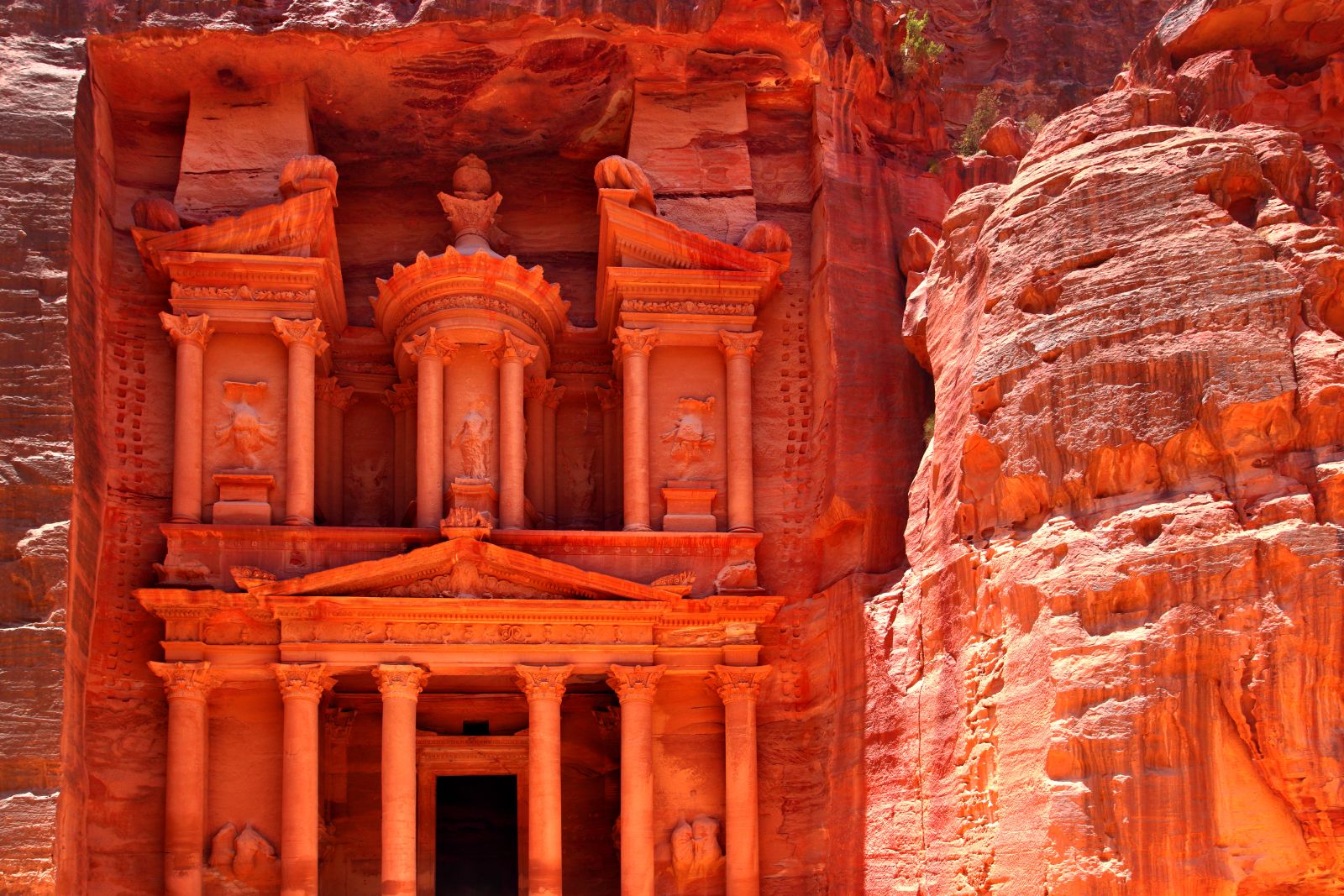 The bright red sandstone of the treasury at Petra in Jordan