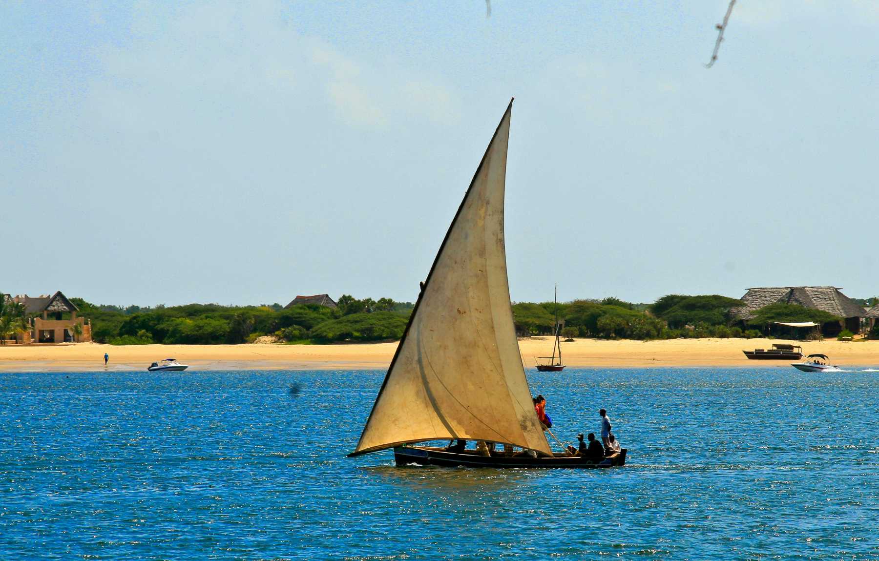 People sailing a dhow in Kenya