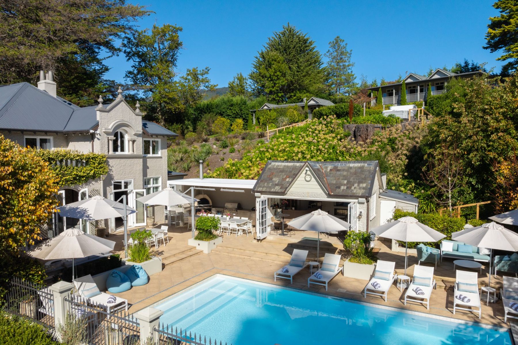 Gardens and swimming pool at Phiopa Retreat in New Zealand