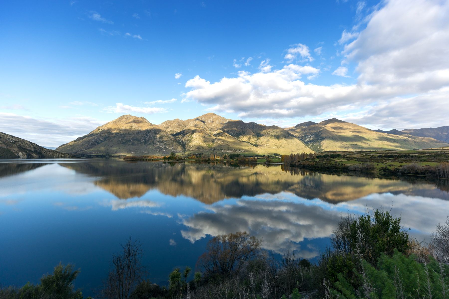 Mountains refelected in the waters of Lake Wanaka New Zealand