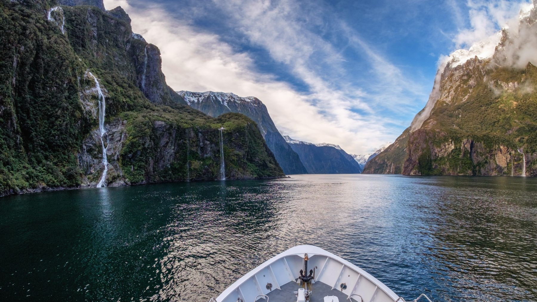 A cruise ship around the waters of Milford Sound