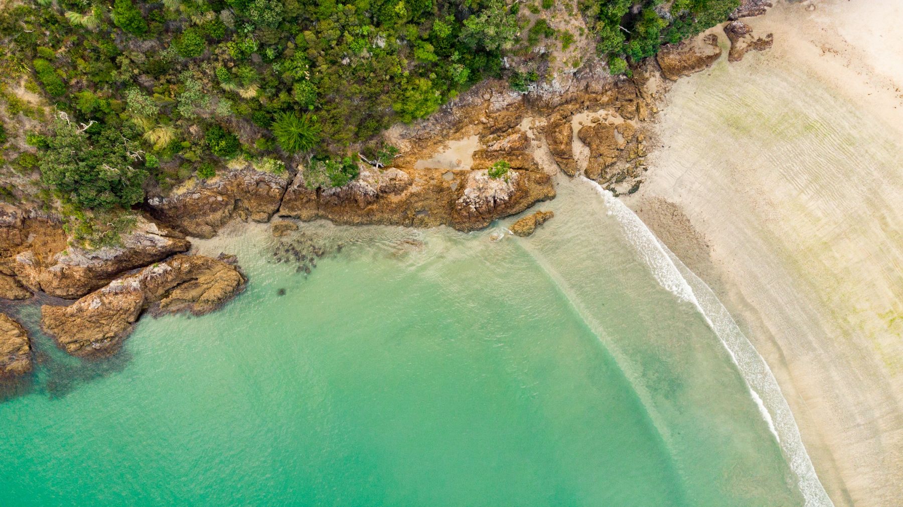 An aerial view of Onetangi Beach on Waiheke Island in New Zealand