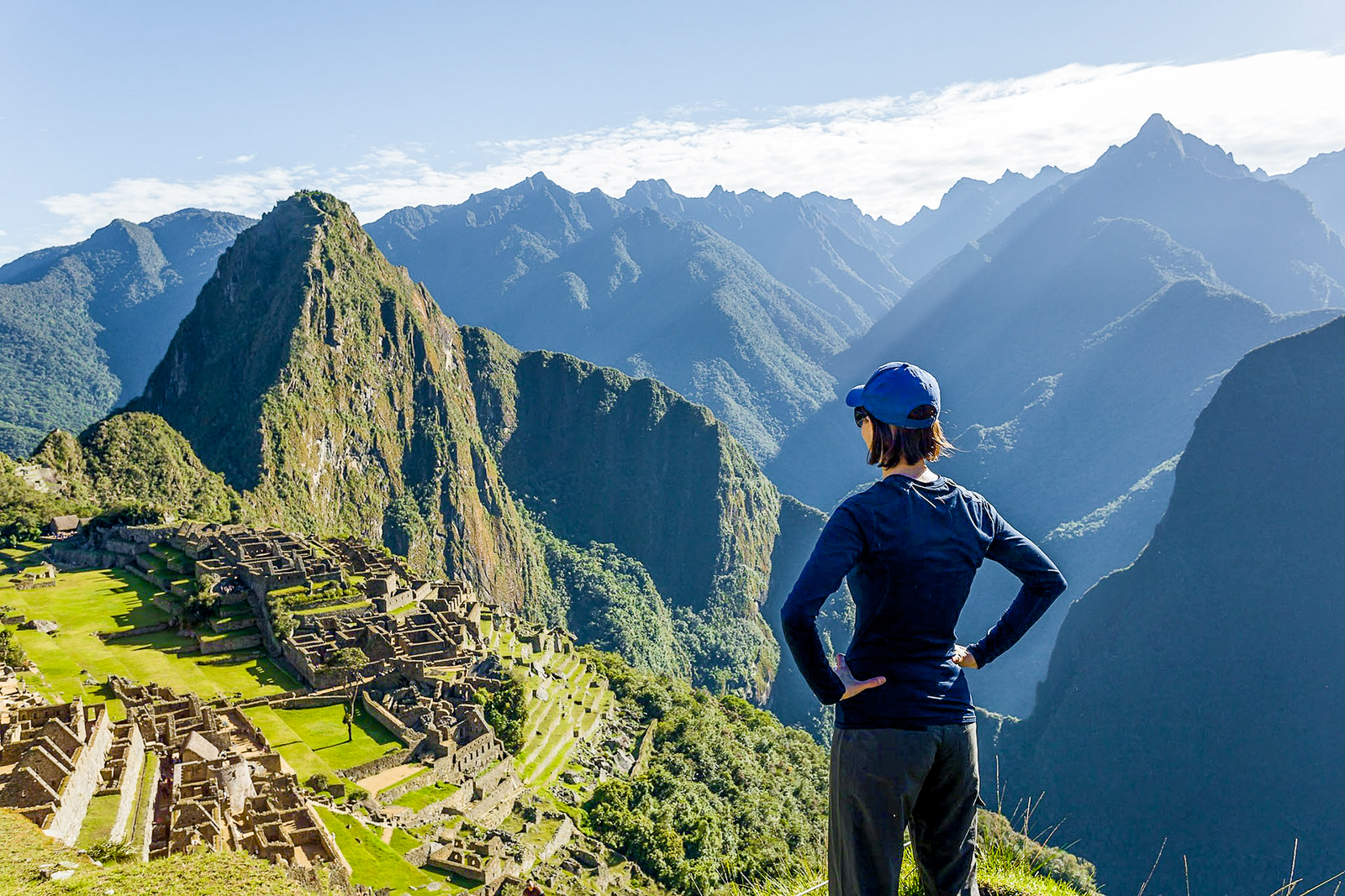 A woman gazing out over Machu Picchu