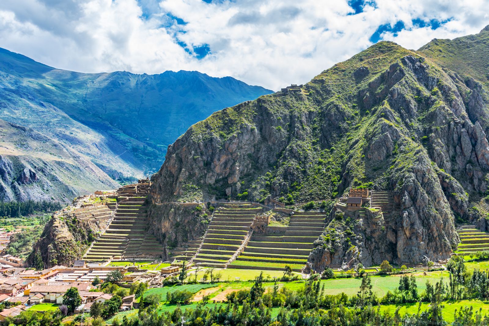 Distant view of the Inca fortress at Ollantaytambo in Peru and the mountain backdrop