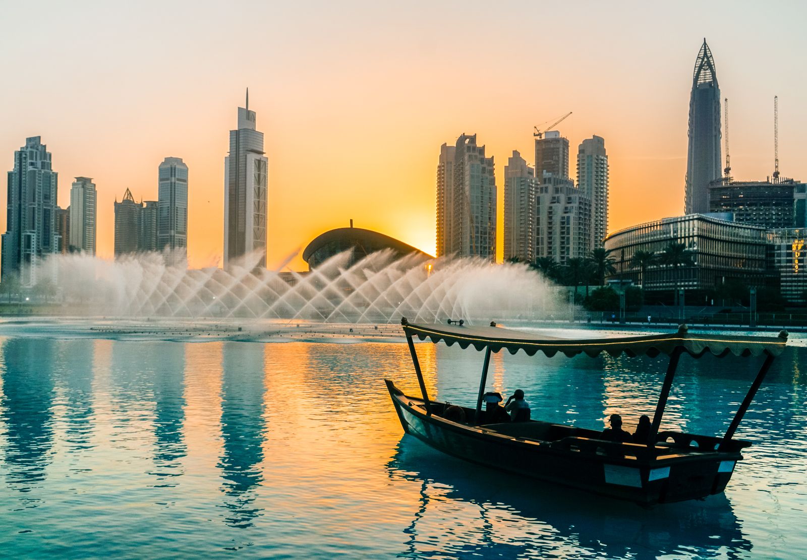 Boat on Dubai creek approaching the fountains