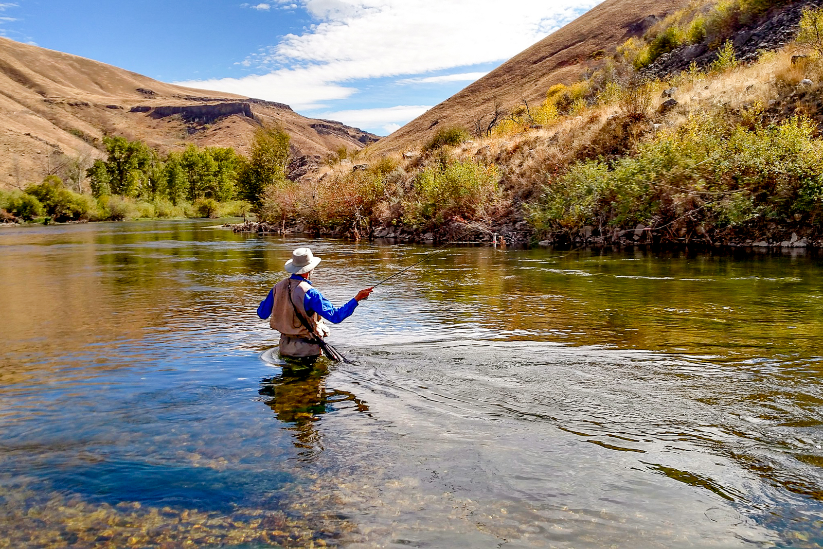 A man fly fishing in Montana