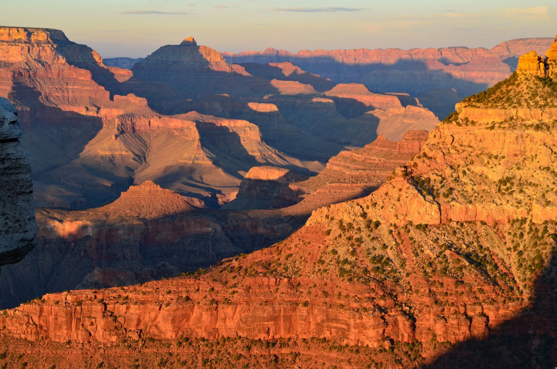 The sun hitting the red cliffs of the Grand Canyon in Arizona USA