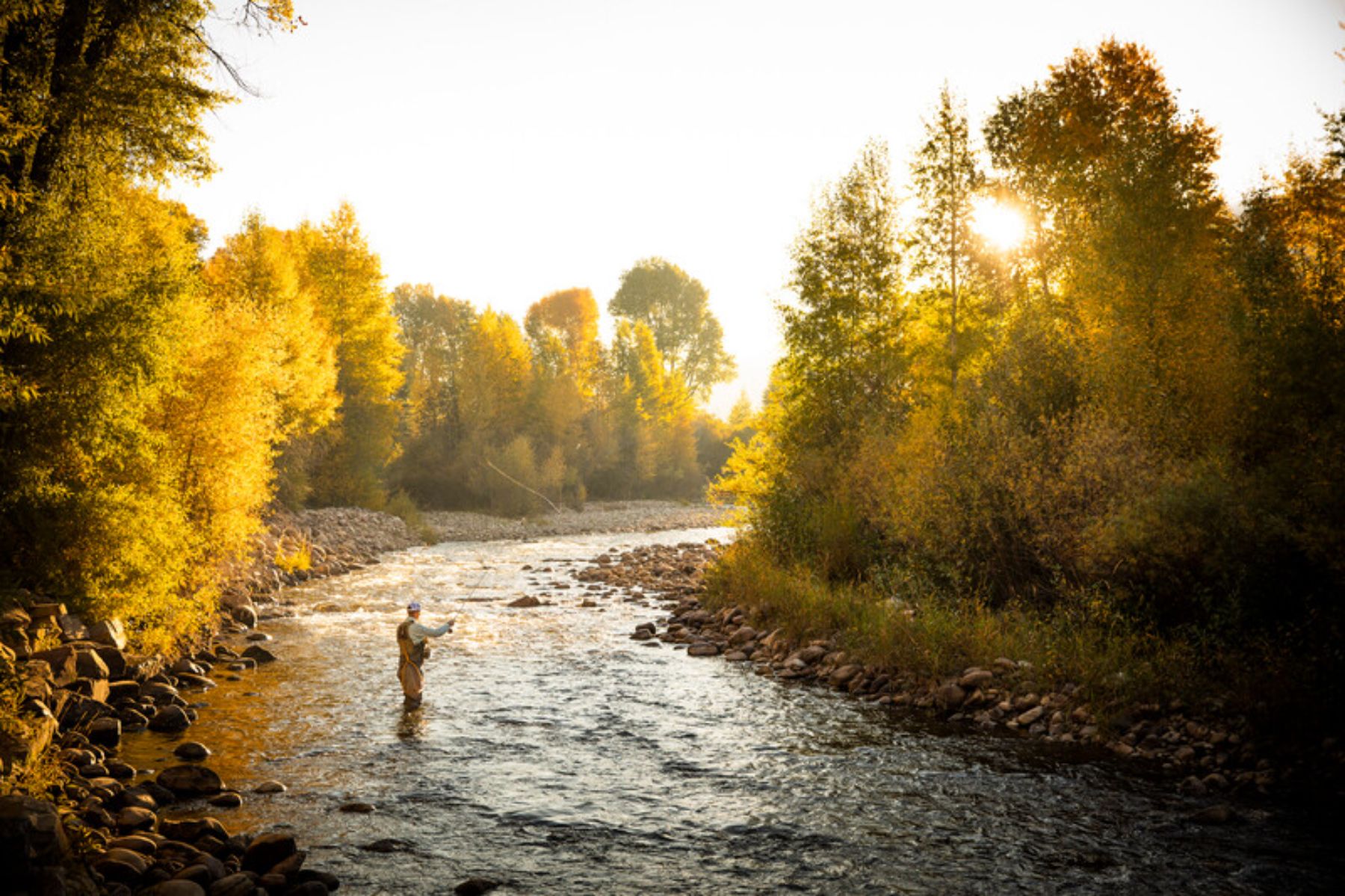 Guest at The Lodge at Blue Sky in Utah fishing in the river