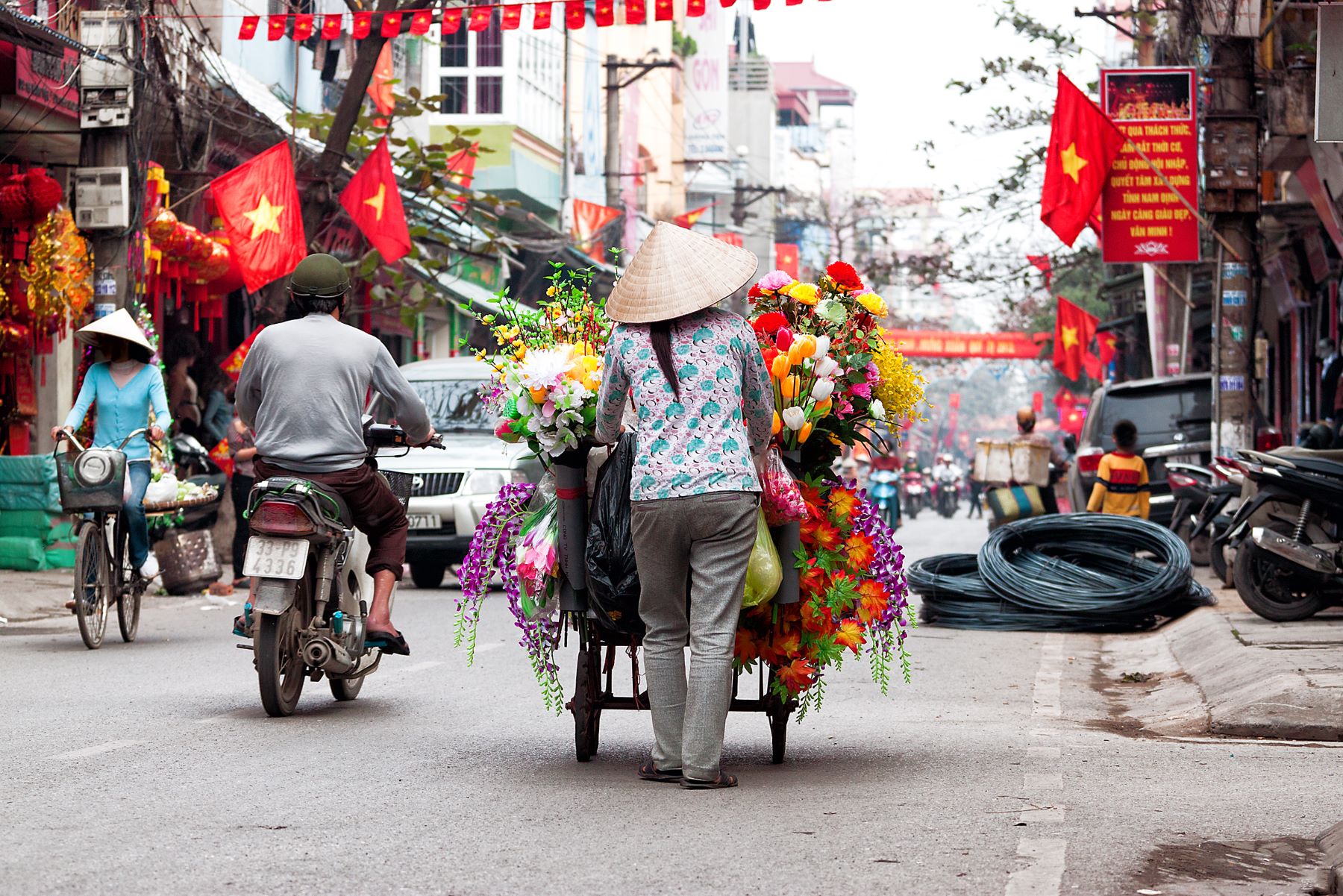 A vendor selling her wares on the streets of Hanoi