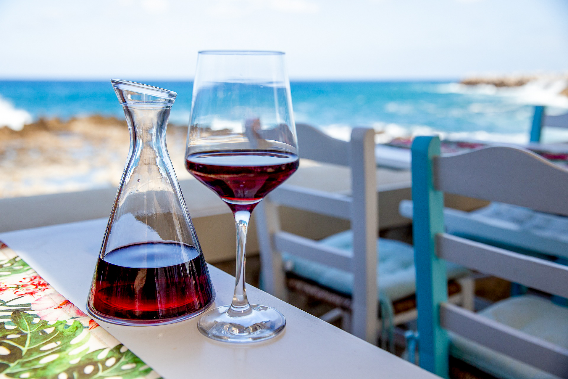 A glass of wine served on a table in Greece