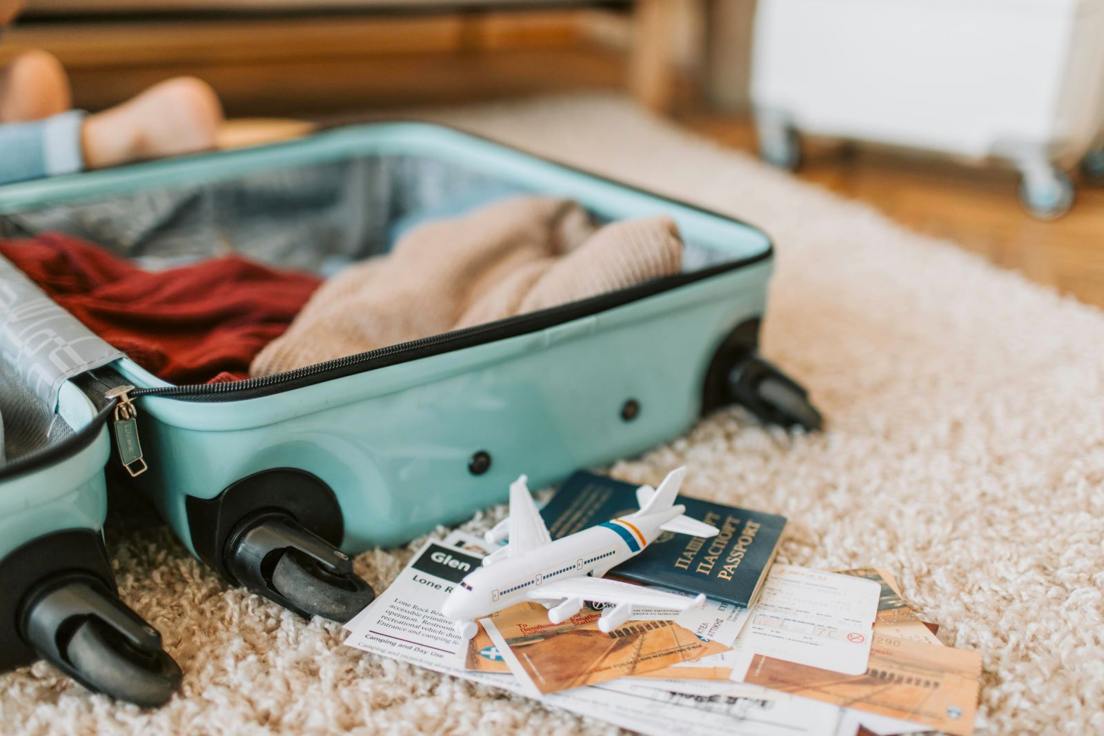 An unpacked suitcase and passport following a sabbatical