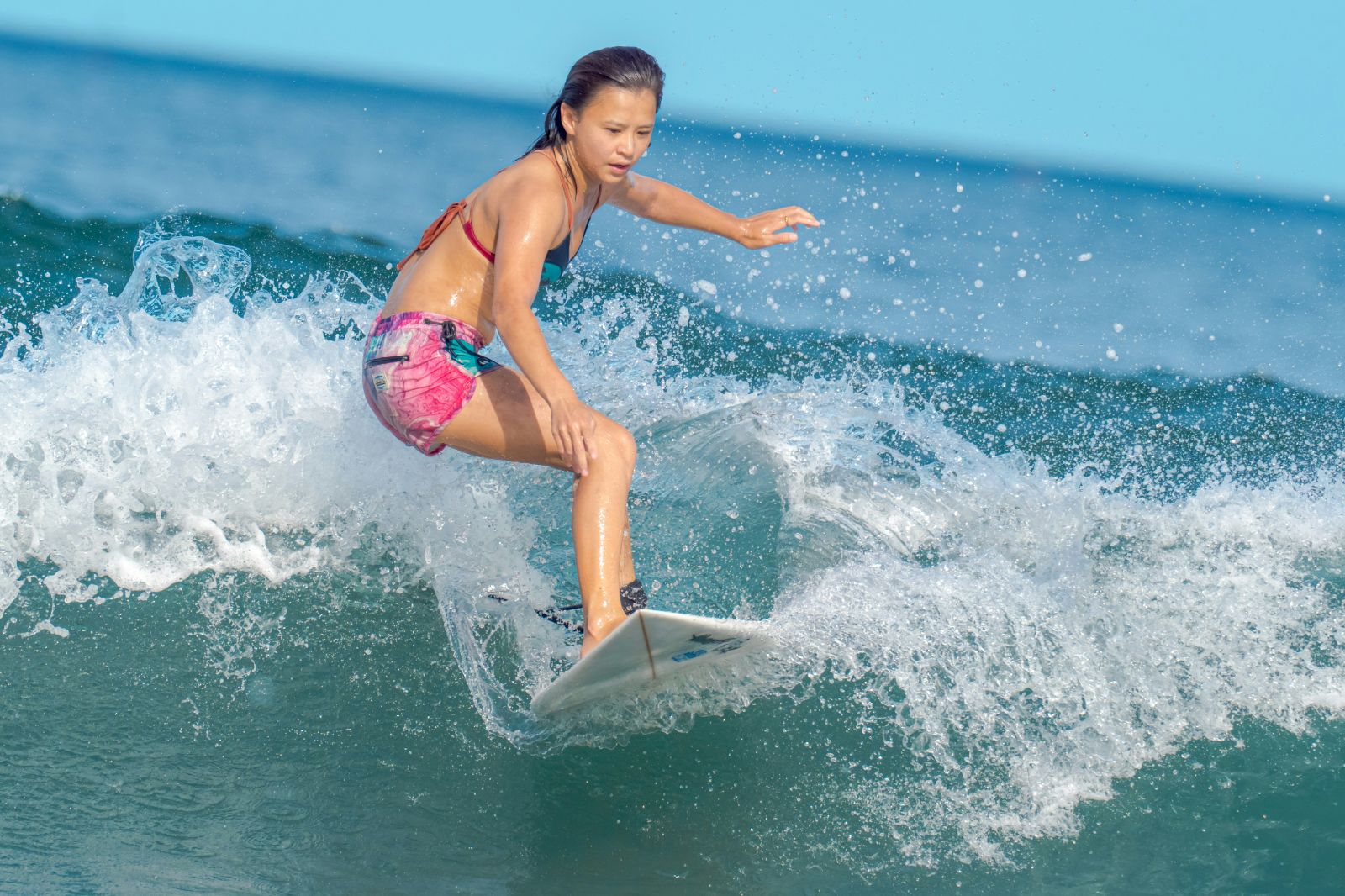 A child learning to surf