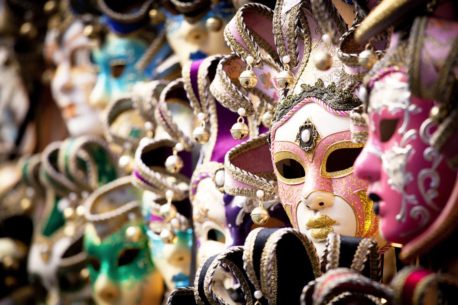 A row of handmade Venetian masks