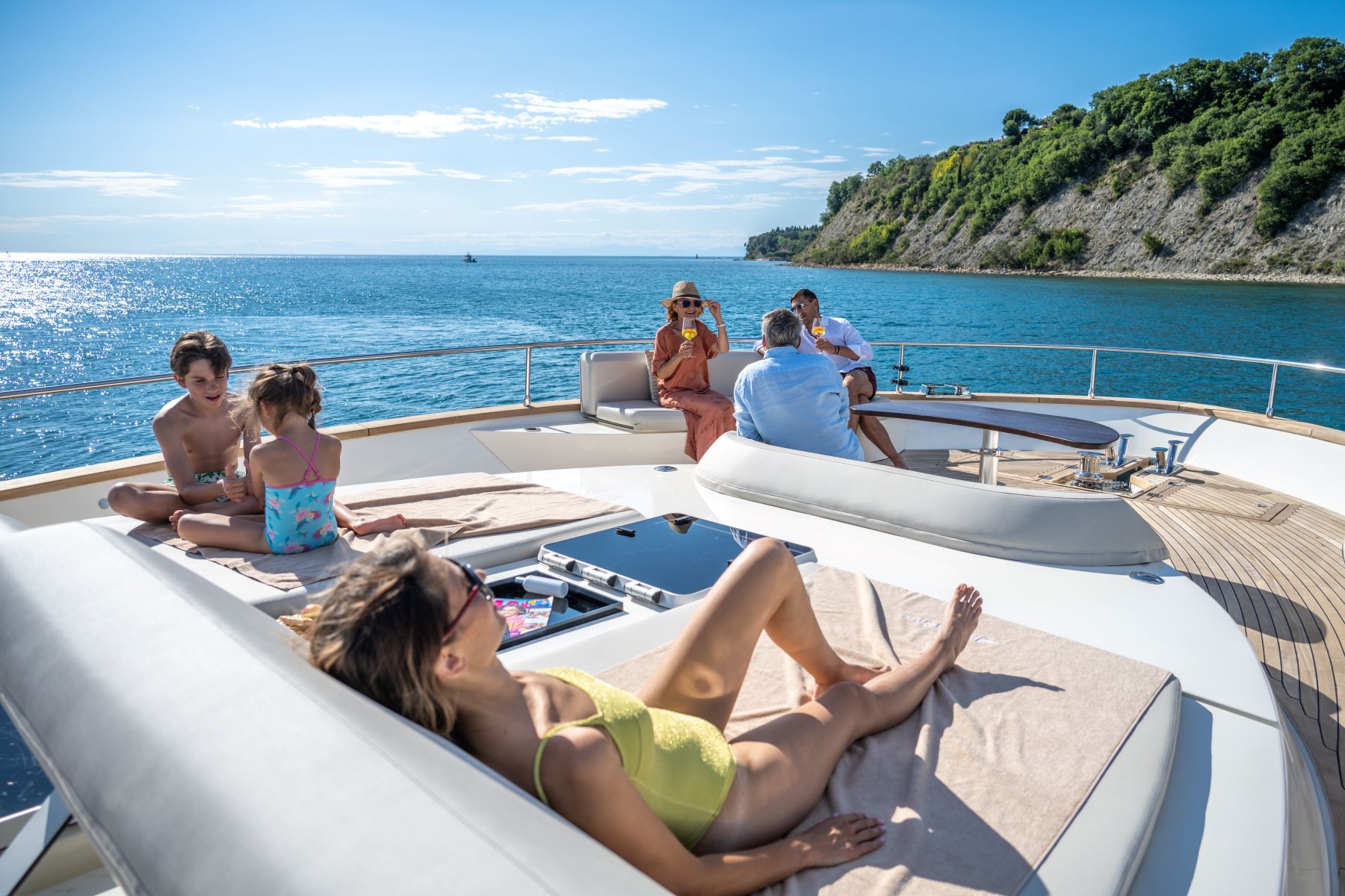 A family lounging on the deck of a luxury gulet yacht in Croatia